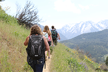 Students hiking up a trail